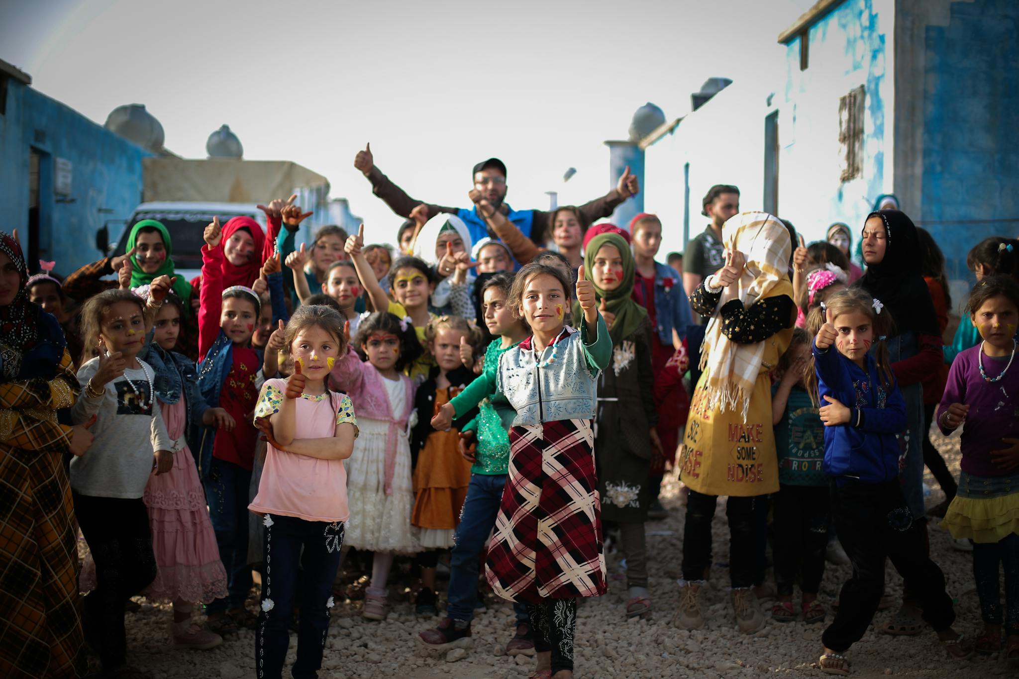 Lively group of children in Idlib, Syria, expressing happiness and unity.